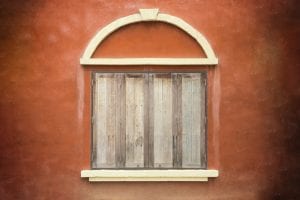 Abstract old wood window on brown cement wall