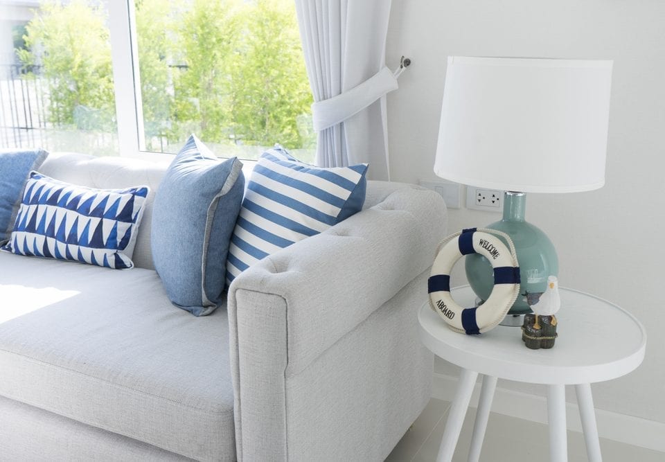 Beach style living room with table lamp