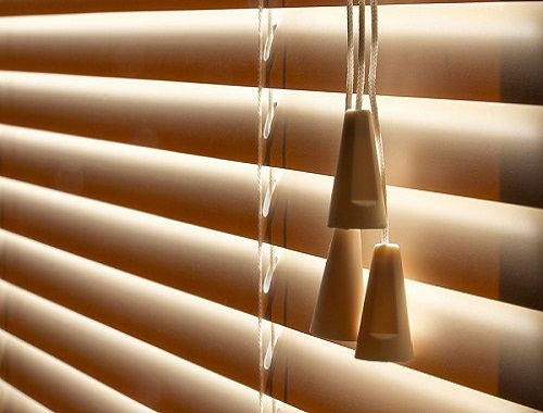 Close up image of venetian blind with pull cords
