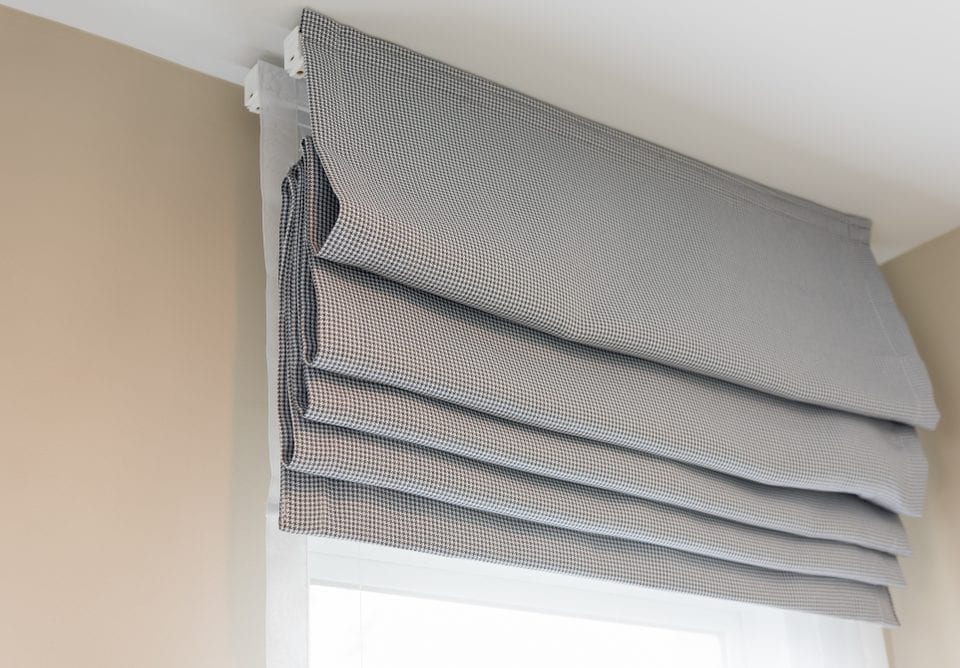 Close up of beautiful grey curtain in cozy room home 