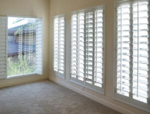 White plantation style wood Shutters for luxury Interior Design in condo 